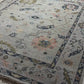Close-up of a patterned rug with a visible textures.
