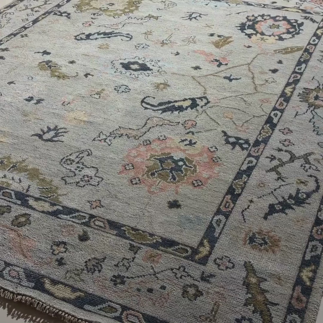 Close-up of a patterned rug with a visible textures.