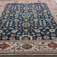 Close-up of intricately patterned rugs with floral and geometric designs.