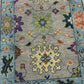 Decorative rug with floral and geometric patterns on a neutral 