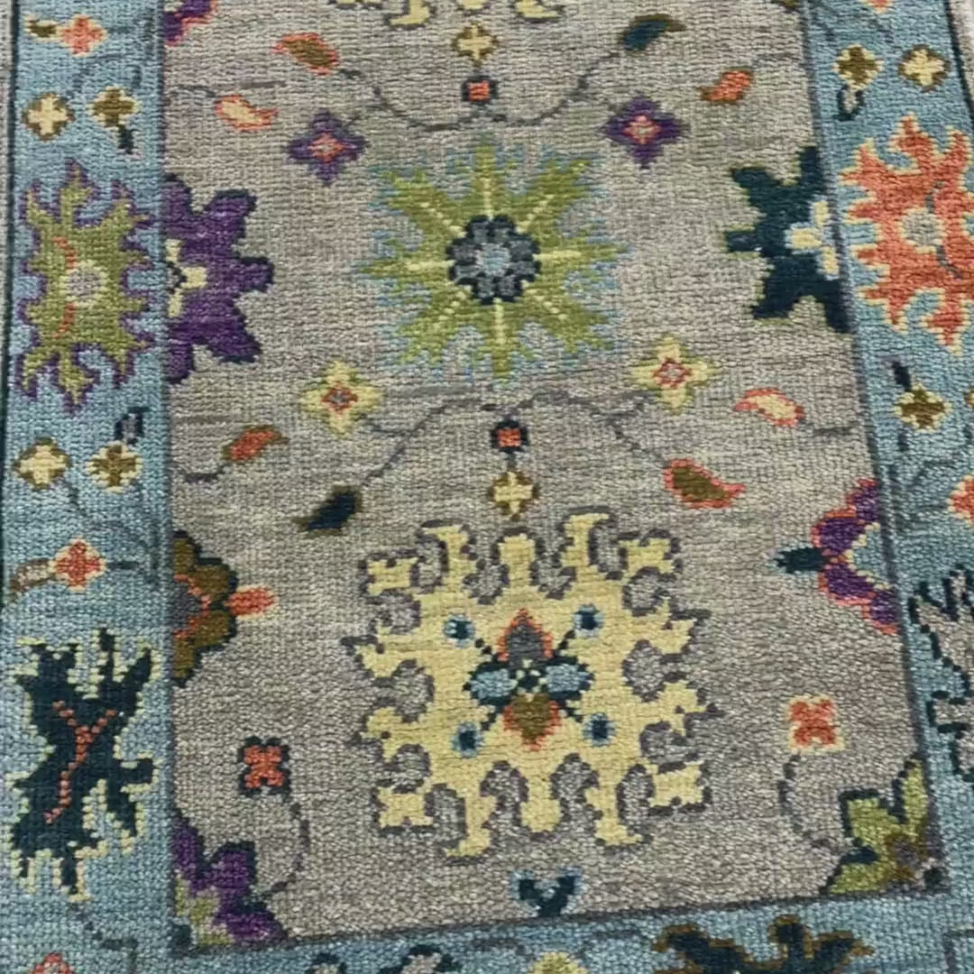Decorative rug with floral and geometric patterns on a neutral 