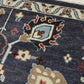 Close-up of a patterned rug with a visible textures.